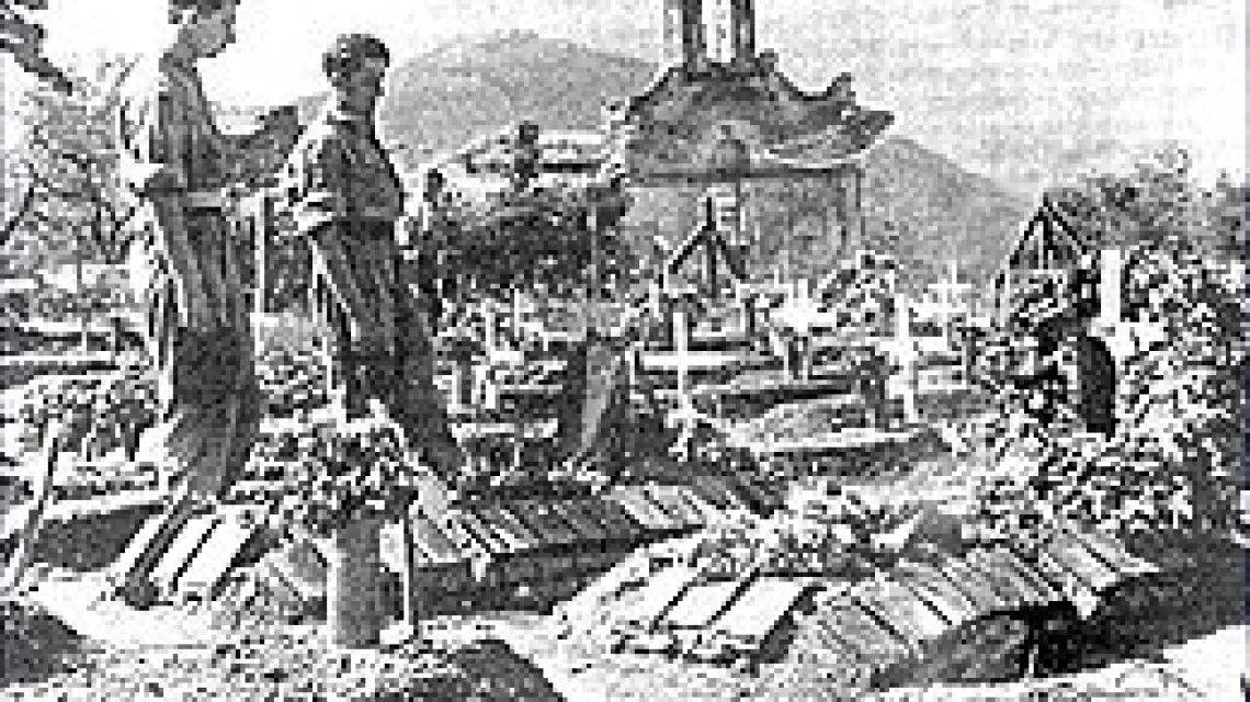 Prowizoryczne groby polskich czołgistów poległych pod Monte Cassino, przykryte gąsienicami / 