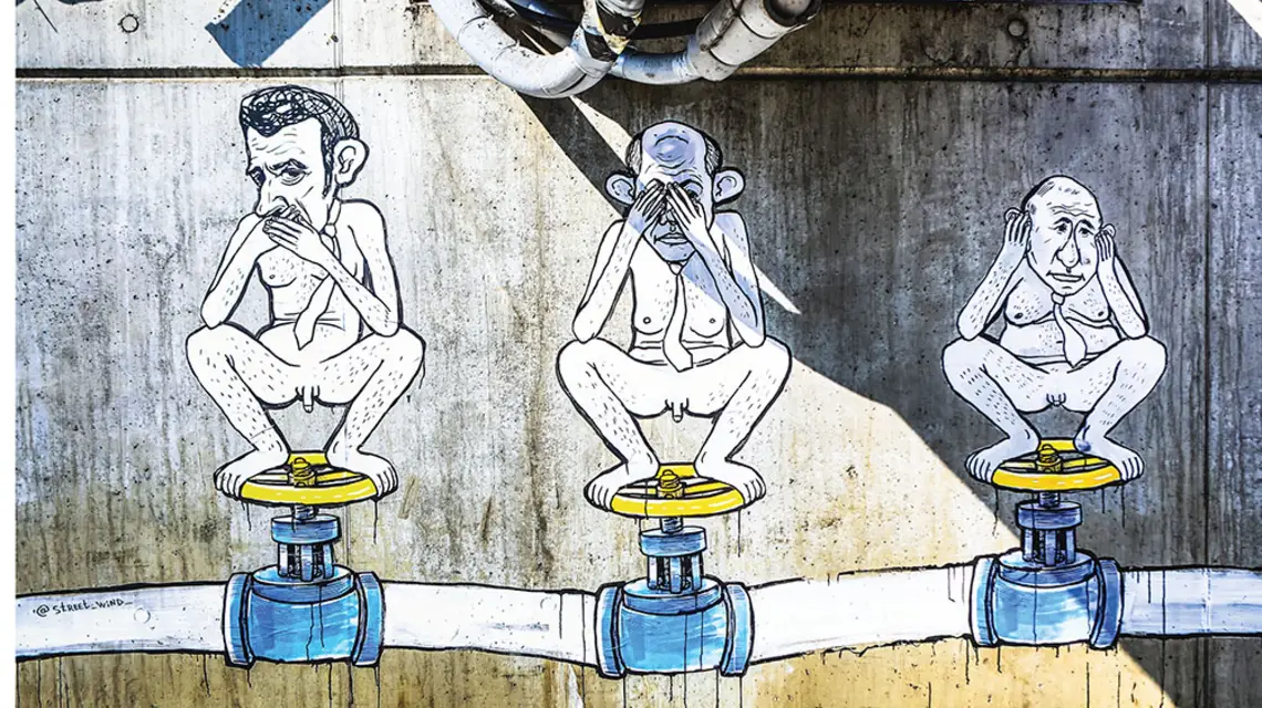 Mural autorstwa Street Wind z karykaturami prezydenta Francji Emmanuela Macrona, kanclerza Niemiec Olafa Scholza i prezydenta Rosji Władimira Putina. Bulwar gen. Pattona, Warszawa, 15 lipca 2022 r. / ADAM BURAKOWSKI / REPORTER / 