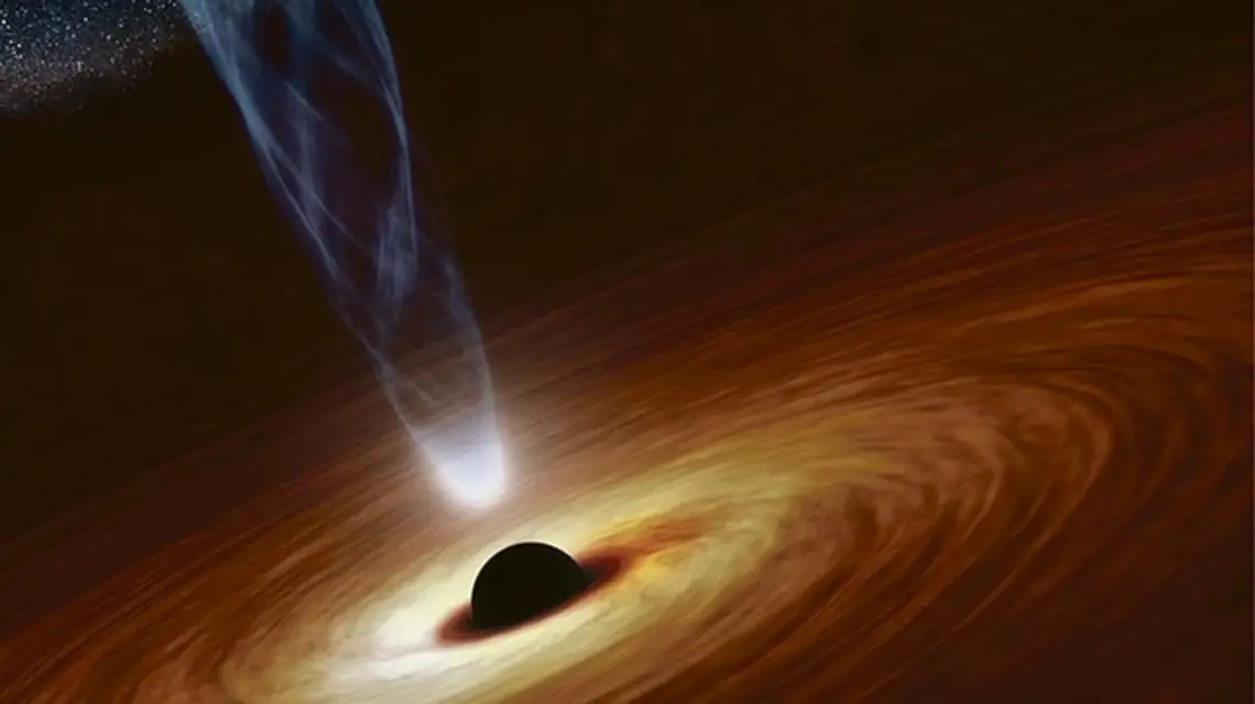 Artystyczna wizja czarnej dziury o masie nawet miliardów Słońc. Wiruje wokół niej materia wciągana przez potężną grawitację. Przedstawiono także strumień naładowanych cząstek zasilany ruchem obrotowym czarnej dziury. / Fot. NASA / JPL-Caltech