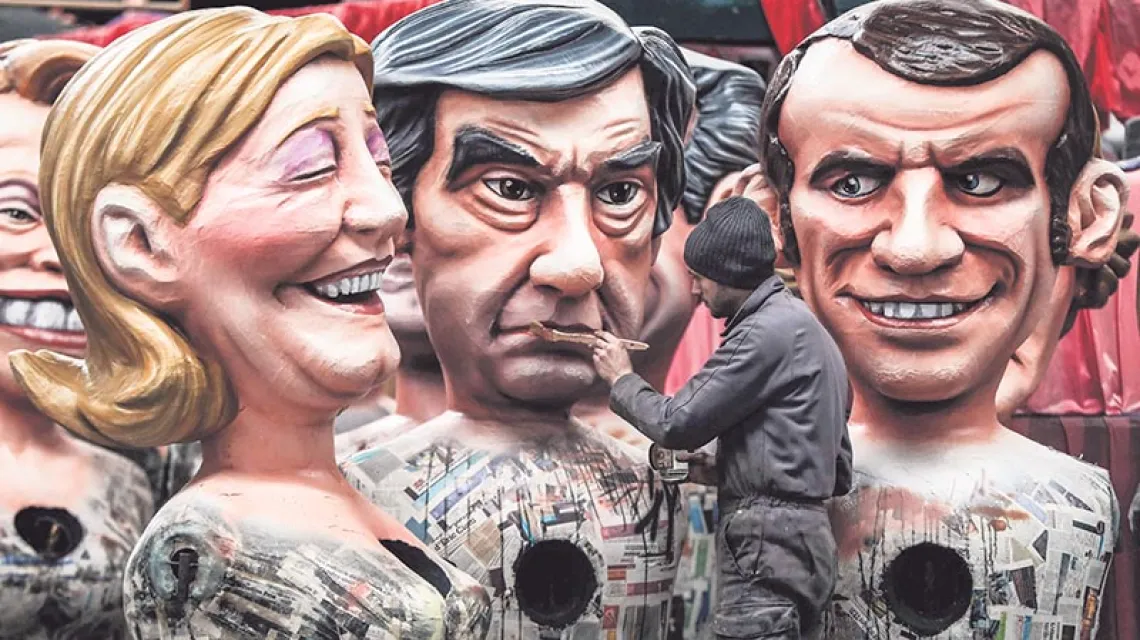 Kandydaci – Marine Le Pen, François Fillon i Emmanuel Macron – jako karnawałowe figury, Nicea, 27 stycznia 2017 r. / Fot. Valery Hache / AFP / EAST NEWS