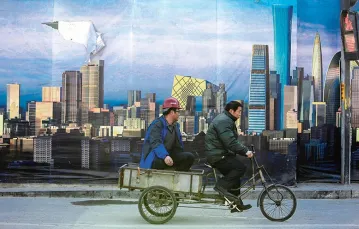 Billboard reklamujący nowo budowaną dzielnicę biznesową w Pekinie, grudzień 2014 r. / Fot. Jason Lee / REUTERS / FORUM
