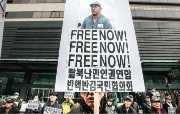 Demonstracja na rzecz uwolnienia misjonarza Kennetha Bae, który spędził 2,5 roku w północno-koreańskim obozie pracy. Seul, luty 2014 r.  / Fot. Ahn Young-Joon / AP / EAST NEWS