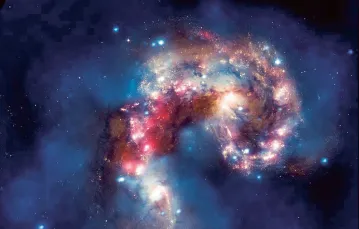 Kolizja dwóch galaktyk oddalonych od Ziemi o 62 mln lat świetlnych. / NASA