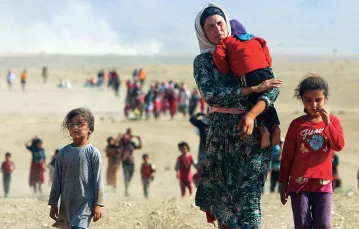 Współczesne ofiary plagi wojny. Jazydzi uciekają przed przemocą ze strony Państwa Islamskiego.  Sindżar, Irak, sierpień 2014 r. / RODI SAID / REUTERS / FORUM