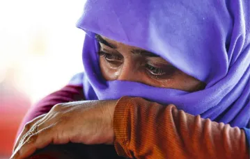 Tej irackiej jezydce udało się uciec spod Mosulu aż do Turcji; sierpień 2014 r. / Fot. Huseyin Bagis / ANADOLU AGENCY / EAST NEWS
