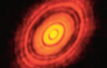 Dysk protoplanetarny wokół gwiazdy HL Tauri. Jeszcze parę milionów lat temu była to nieciekawa chmura zapylonego gazu. Niedługo przemieni się w układ planetarny. Tak powstają światy. / Fot. ALMA / ESO / NASA