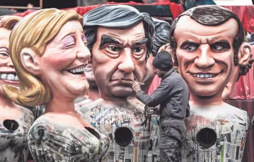 Kandydaci – Marine Le Pen, François Fillon i Emmanuel Macron – jako karnawałowe figury, Nicea, 27 stycznia 2017 r. / Fot. Valery Hache / AFP / EAST NEWS