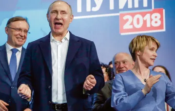 Władimir Putin świętuje zwycięstwo w wyborach prezydenckich, Moskwa, 18 marca 2018 r. / Fot. SERGEI ILNITSKY / EPA / PAP