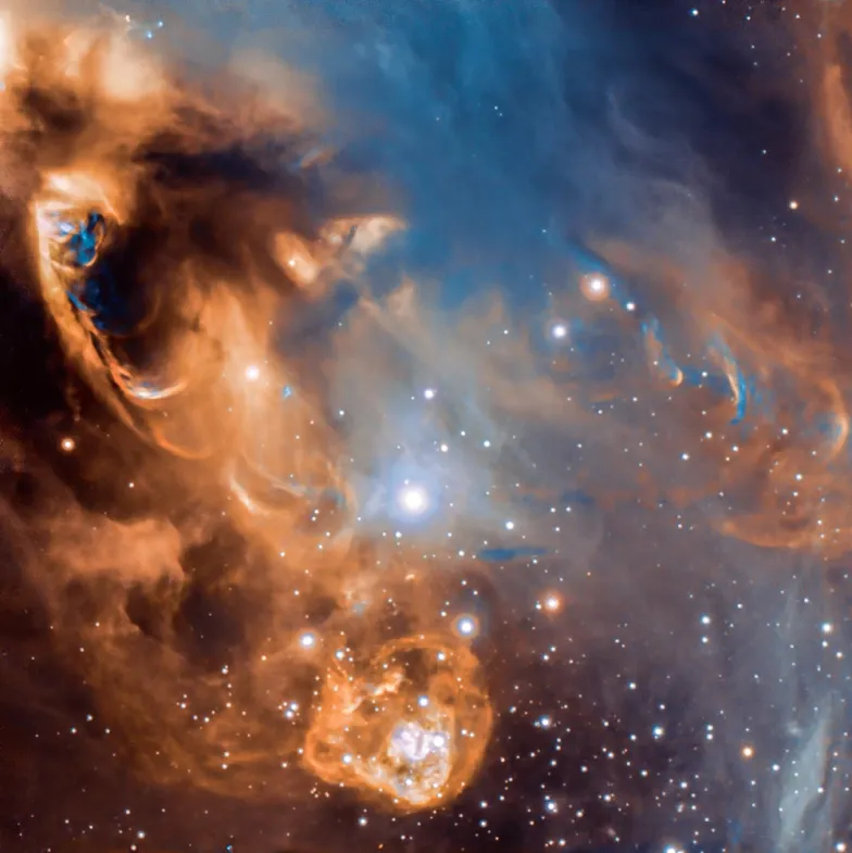 Gwiezdny żłobek. Młode gwiazdy spowite są chmurami galaktycznego pyłu i gazu / ESO